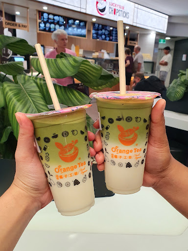Two Orange Tea drinks held at Toowong Village